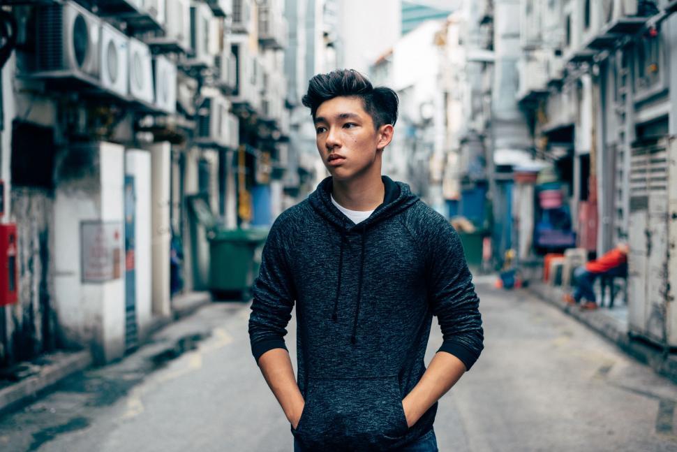 Free Image of Man Standing in the Middle of a Street 