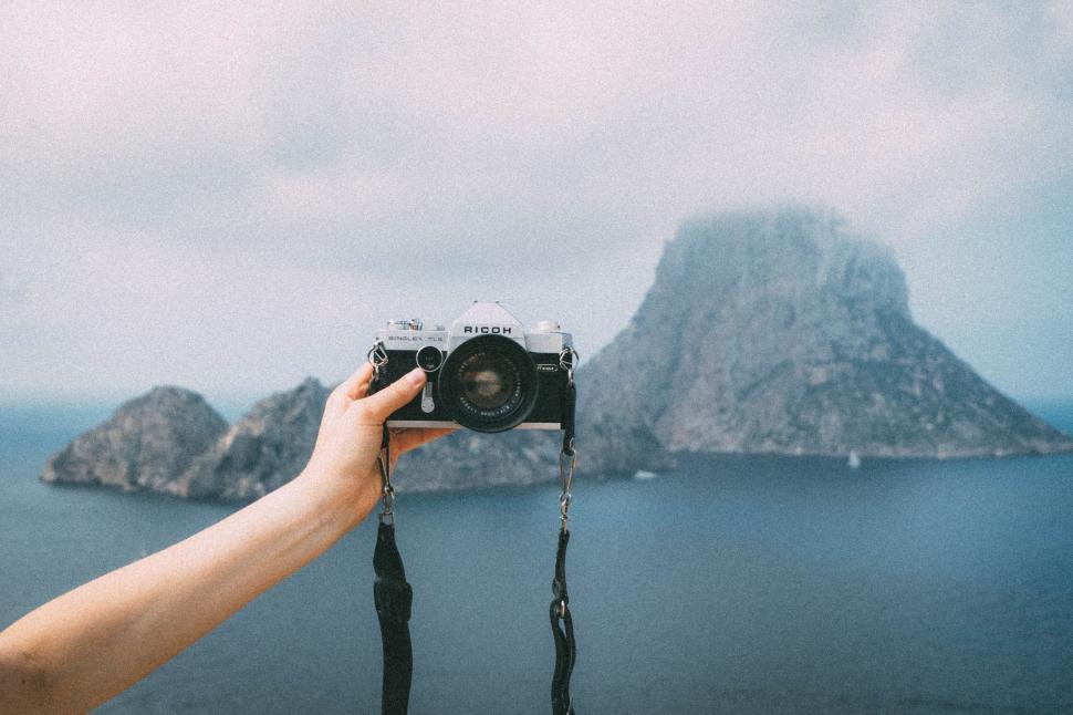 Free Image of Person Taking a Picture With a Camera 