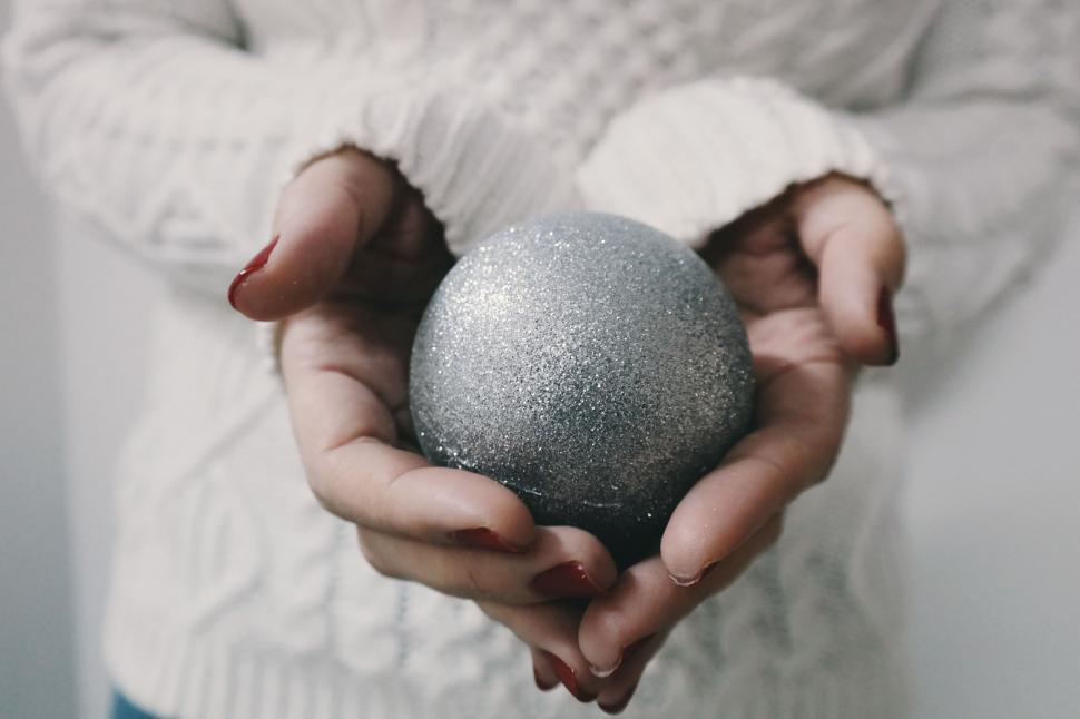Free Image of Person Holding a Ball in Hands 