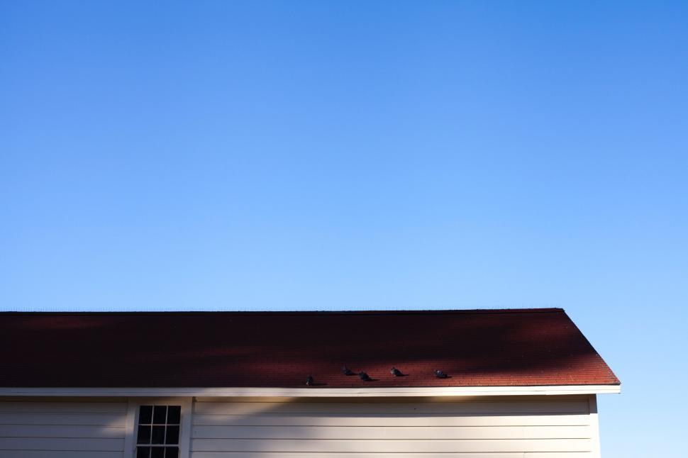 Free Image of Small White House With Red Roof 