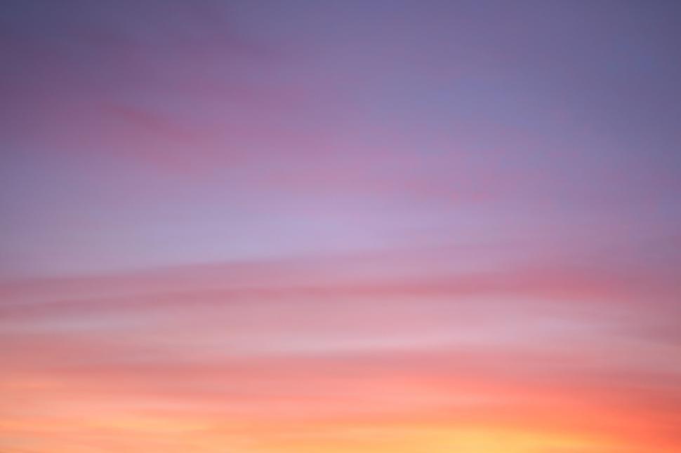 Free Image of Group of People Standing on Beach at Sunset 