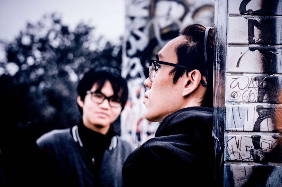 Free Image of Two Men Standing Next to Each Other 