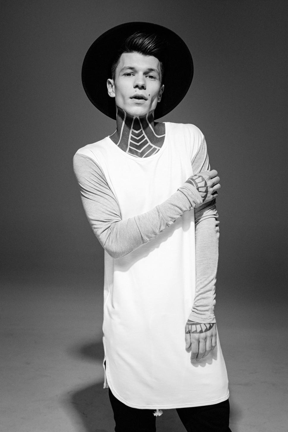 Free Image of Man Wearing Hat and White Shirt 