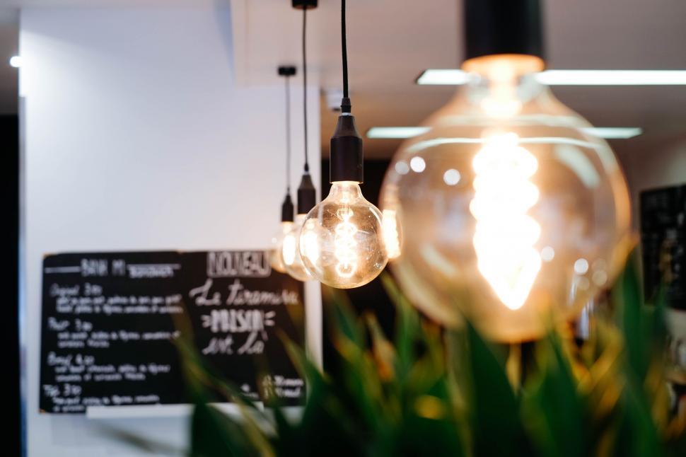 Free Image of Cluster of Light Bulbs Hanging From Ceiling 