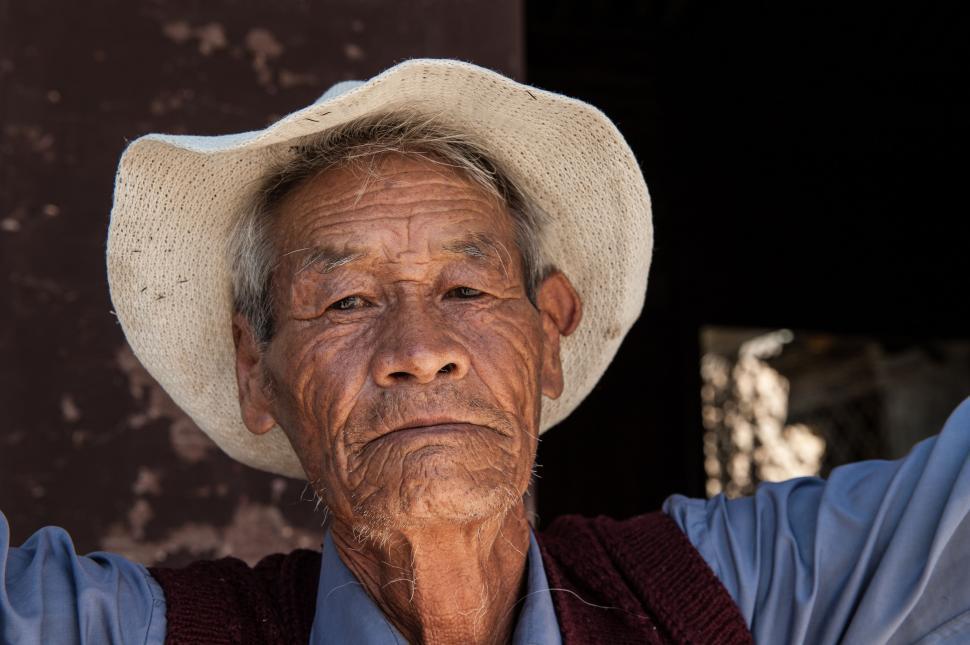 Free Image of Old Man in White Hat and Blue Shirt 