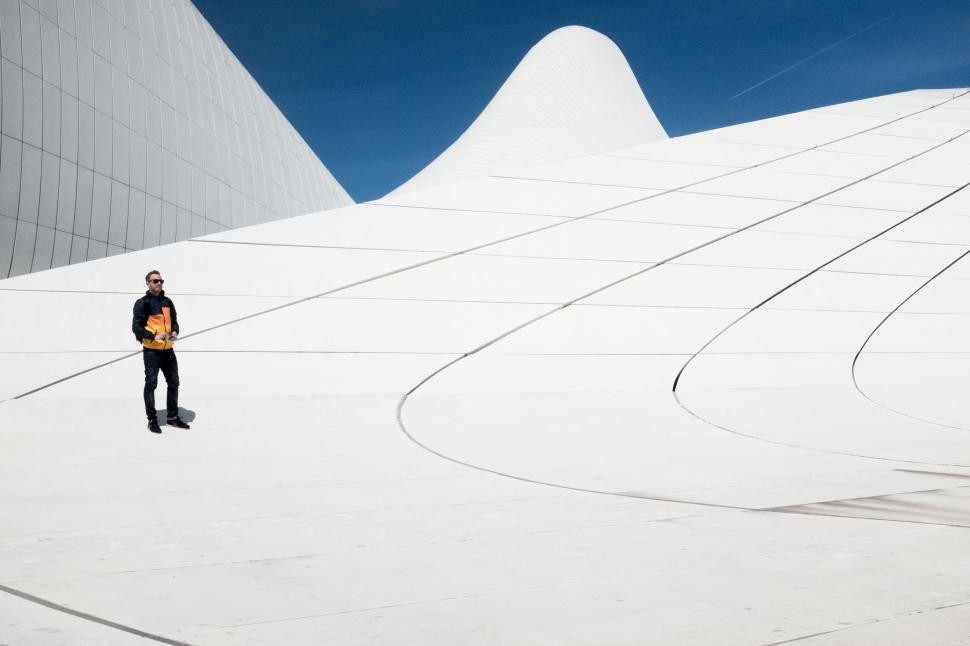 Free Image of Man Standing on Snow Covered Slope 