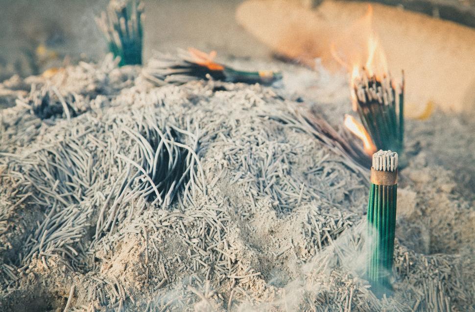 Free Image of Two Green Brushes on Top of Snow Pile 