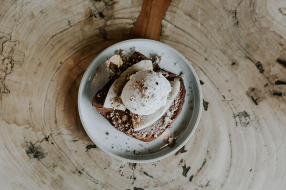 Free Image of White Bowl Filled With Food on Wooden Table 