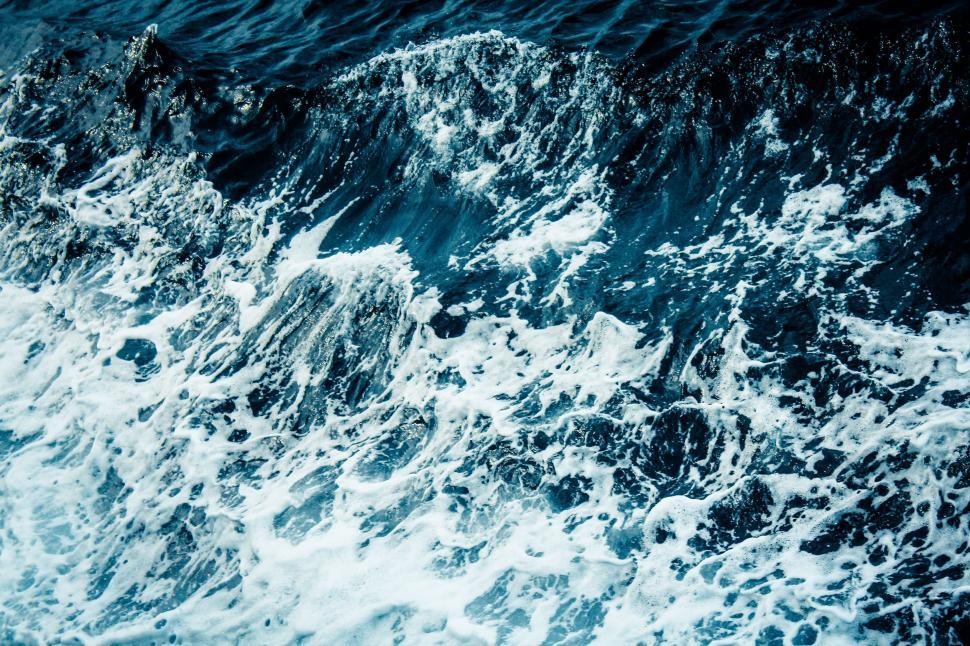 Free Image of Vast Body of Water Covered in Foam 