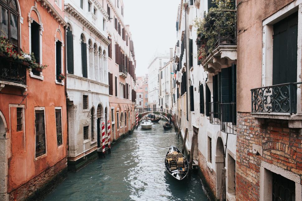 Free Image of Small Boat Navigating Narrow Canal 