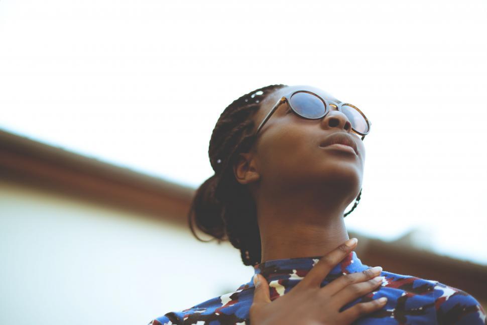 Free Image of Woman Wearing Sunglasses and Blue Shirt 