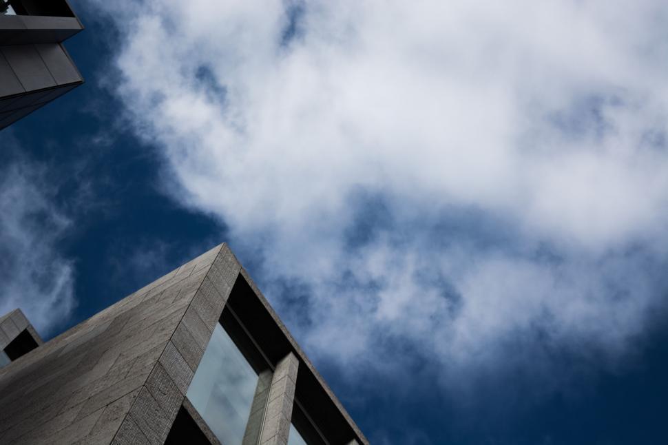 Free Image of Building and Plane Flying in the Sky 