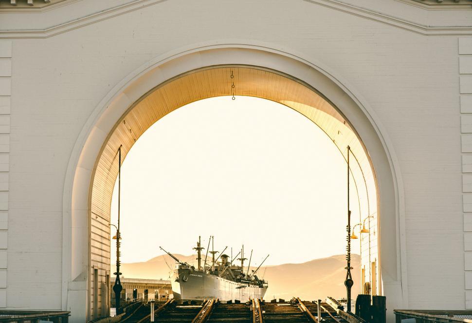 Free Image of Large White Boat on Train Track 