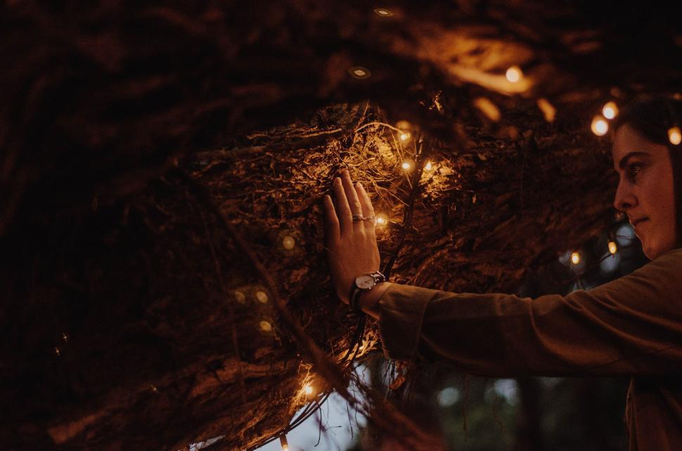 Free Image of Woman Holding Hands Out in the Rain 