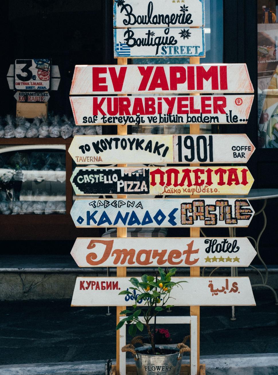 Free Image of Street Sign With Potted Plant 