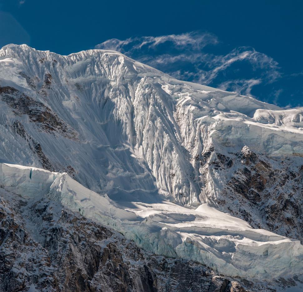 Free Image of Majestic Snow-Covered Mountain Under Blue Sky 