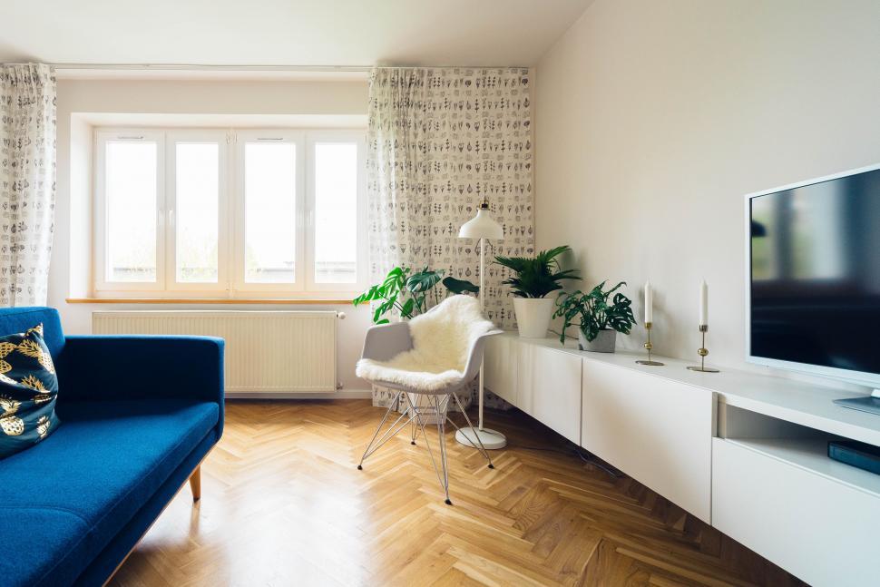Free Image of Blue Couch and Flat Screen TV in Living Room 