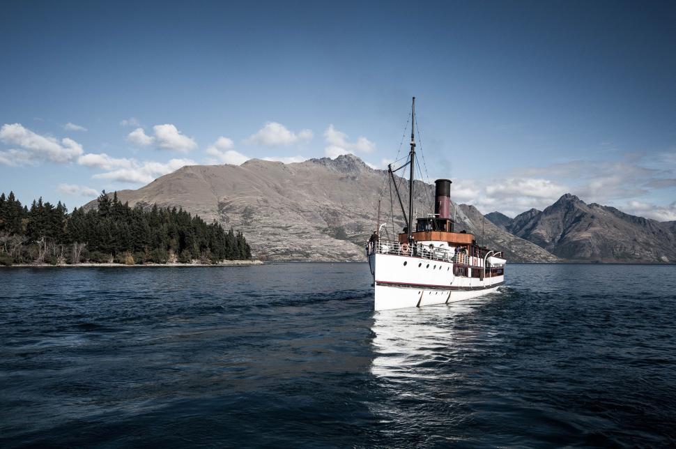 Free Image of Boat Floating on Large Body of Water 