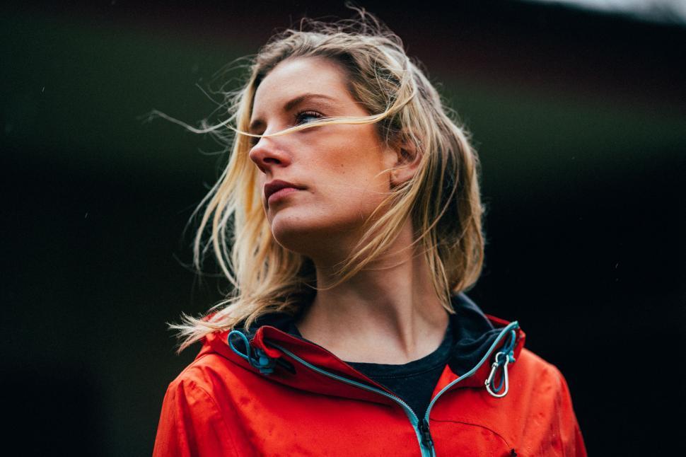 Free Image of Woman in Red Jacket Looking Into the Distance 
