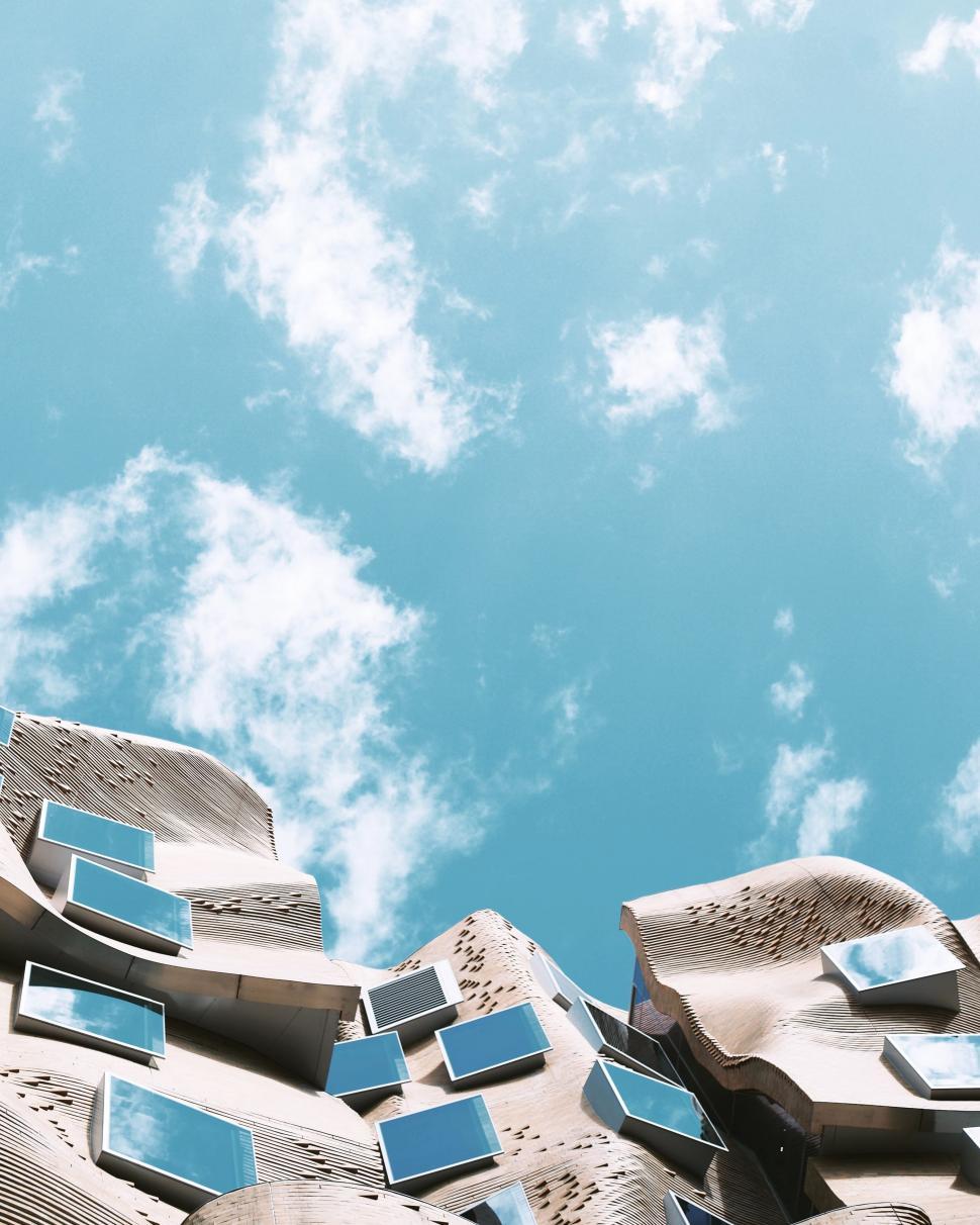 Free Image of Group of Mirrors on Side of Building 