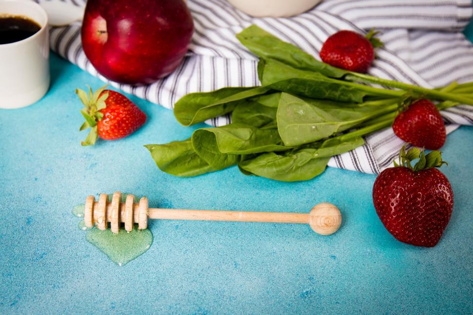 Free Image of Table Set With Apples, Strawberries, and Honey Comb 