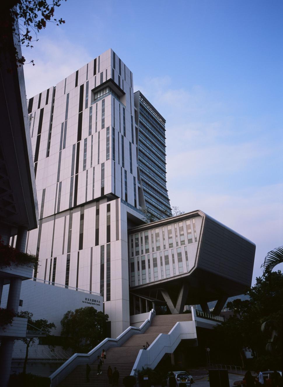 Free Image of Tall Building With Stairs in Front 