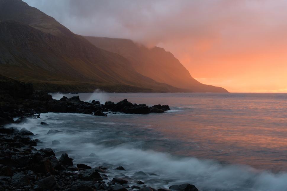 Free Image of Rocky Shoreline Next to a Large Body of Water 