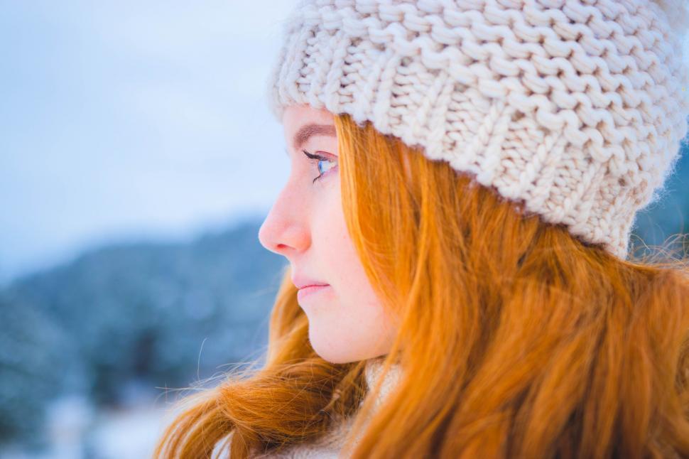 Free Image of Woman With Red Hair Wearing White Hat 