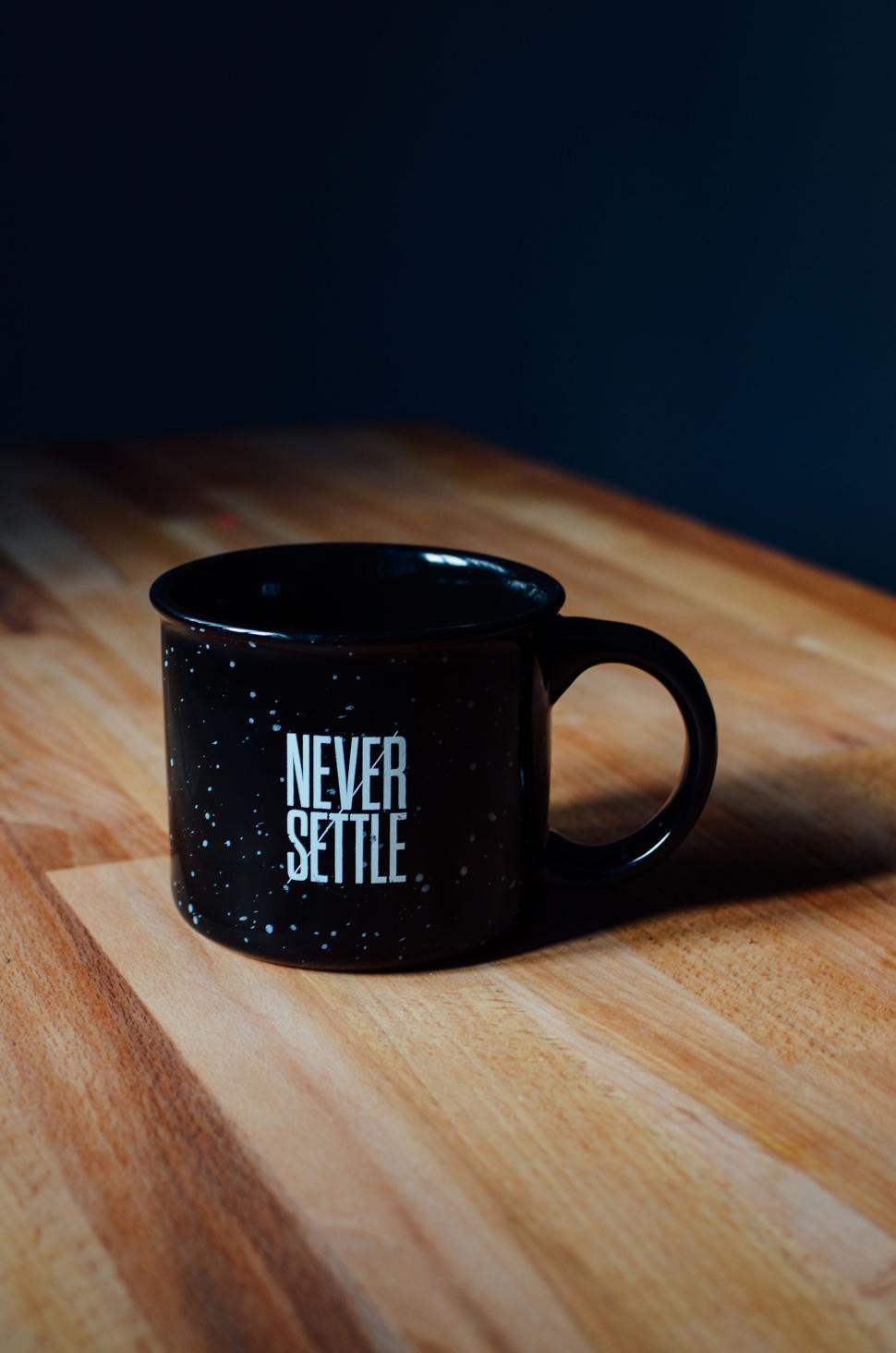 Free Image of Black Coffee Mug on Wooden Table 