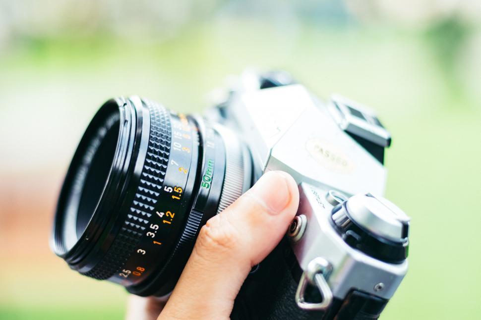 Free Image of Person Holding Camera in Hand 
