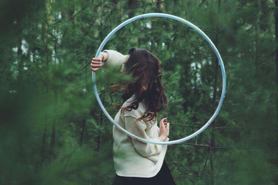 Free Image of Woman Holding White Shirt Hoop 