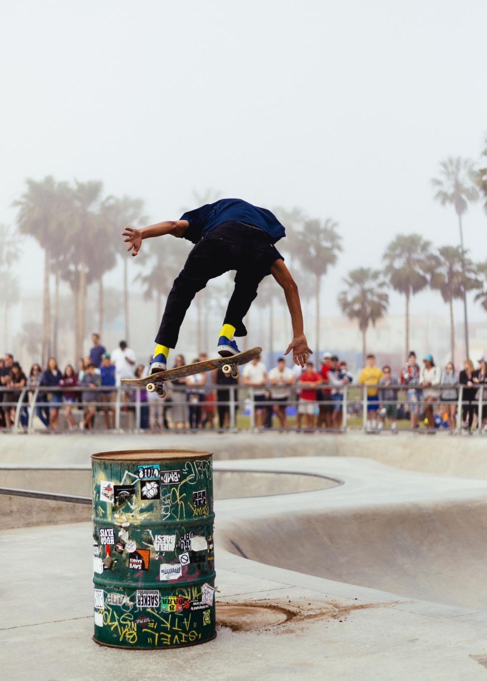Free Image of Man Riding Skateboard Mid-Air 