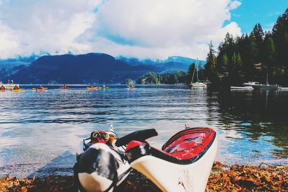 Free Image of Kayak Resting on Lake Shore 