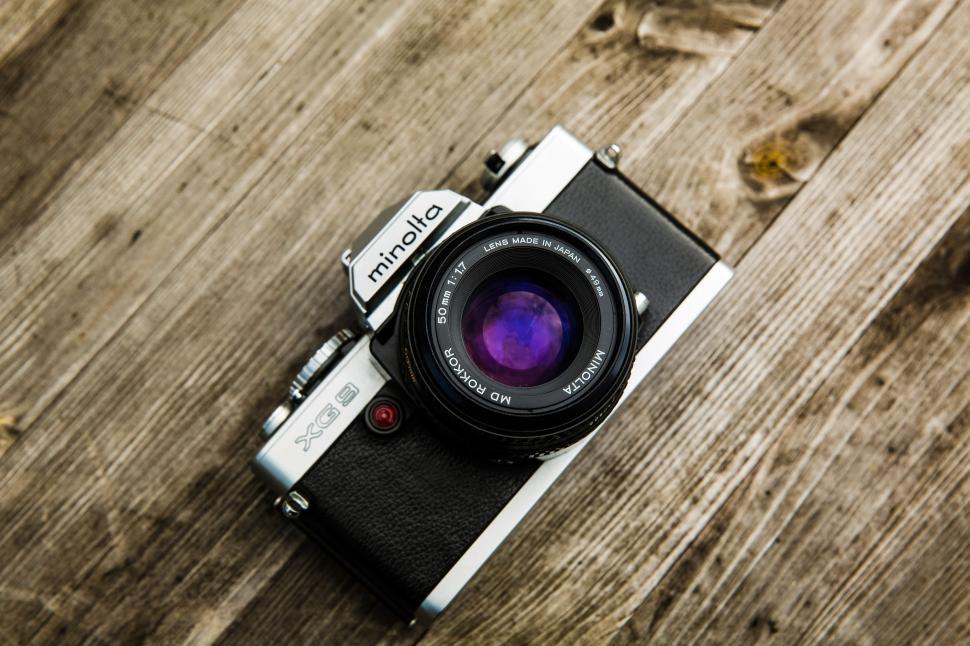 Free Image of Camera on Wooden Table 