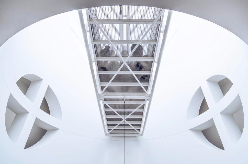 Free Image of Very Tall White Building With Metal Roof 