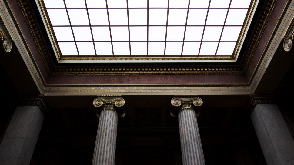 Free Image of Ceiling of a Building With Three Pillars and Skylight 
