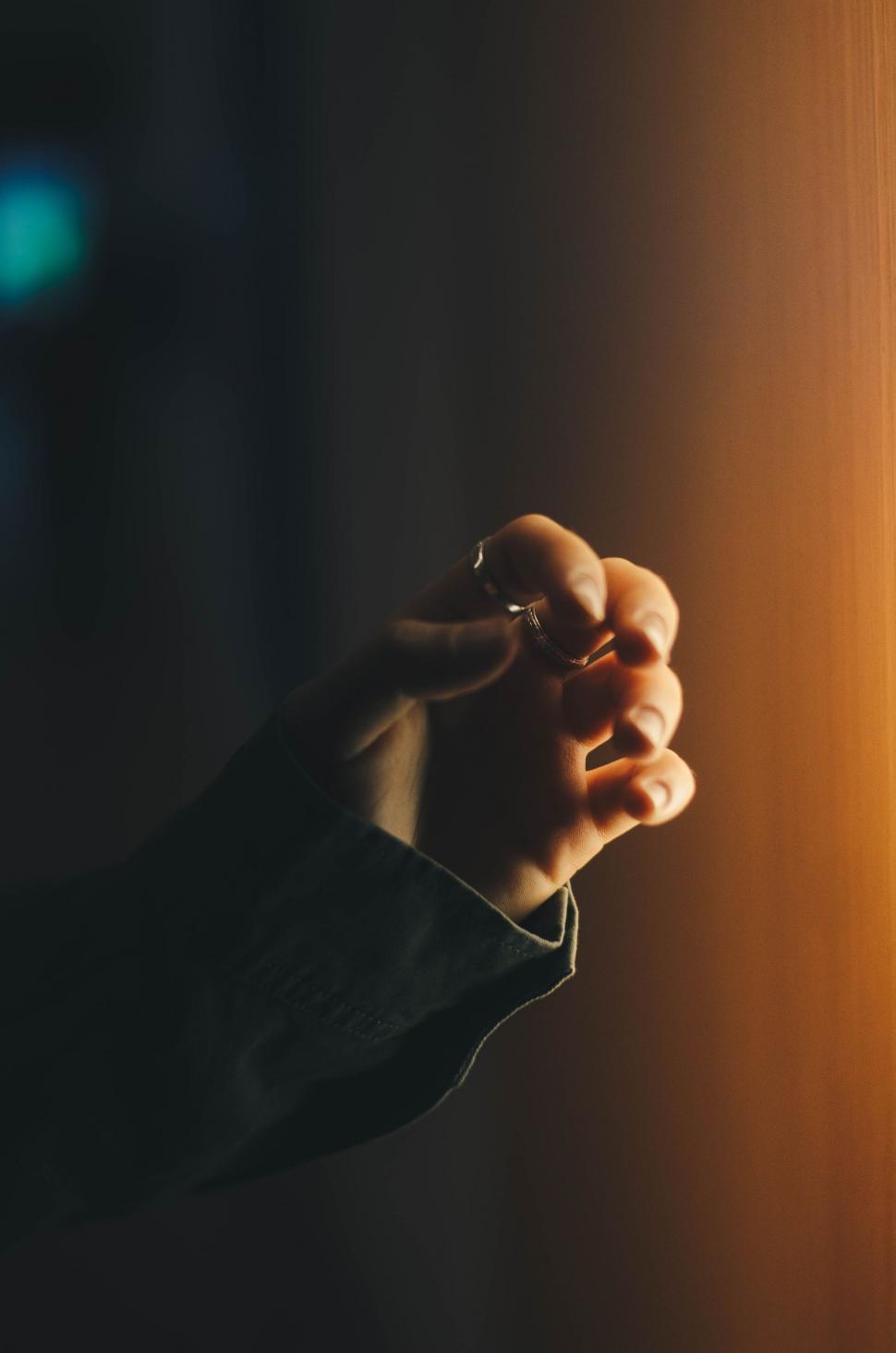 Free Image of Hand Holding Object in Darkness 