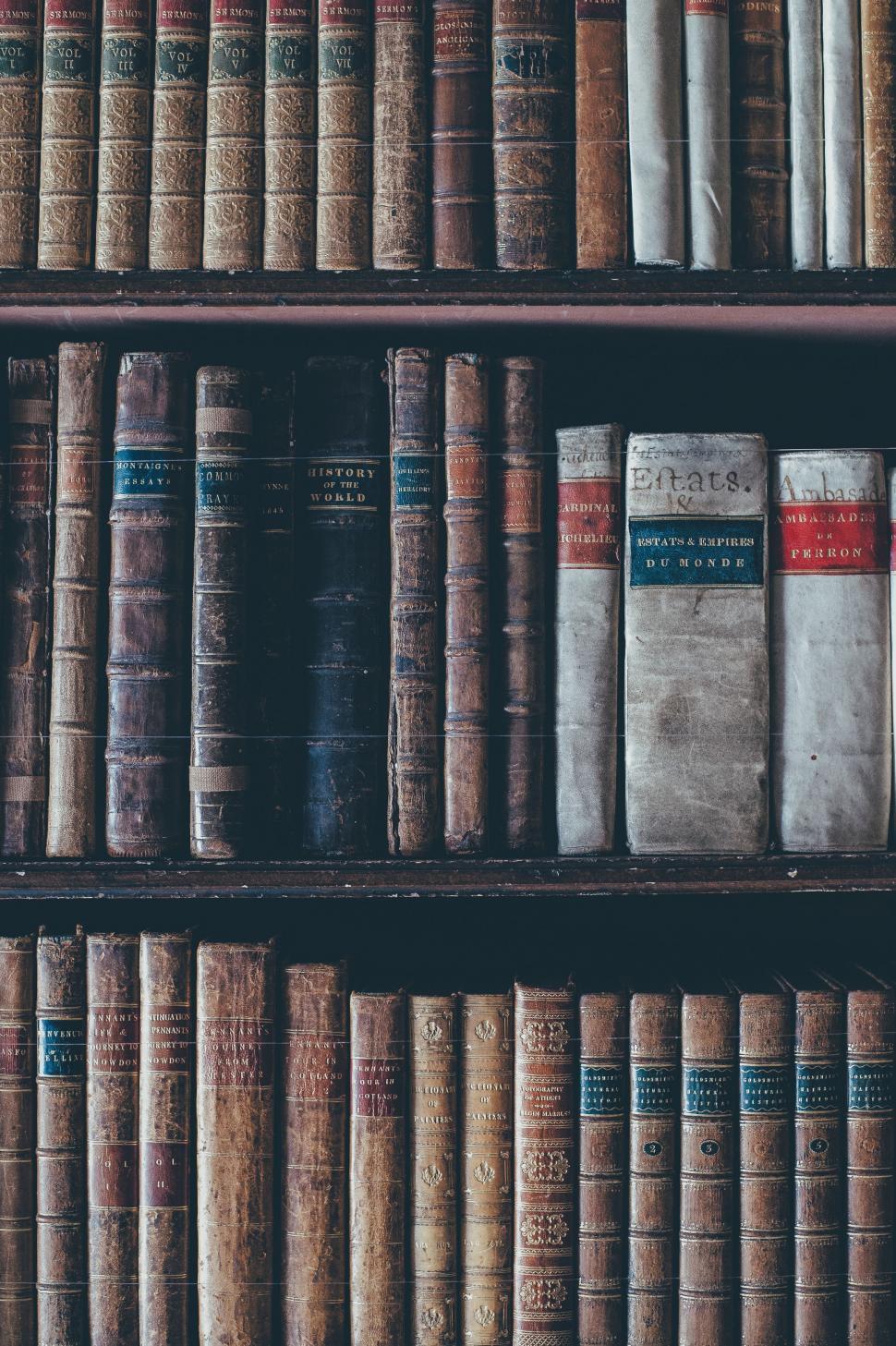 Free Image of A Monstrous Collection of Old Books on a Bookshelf 