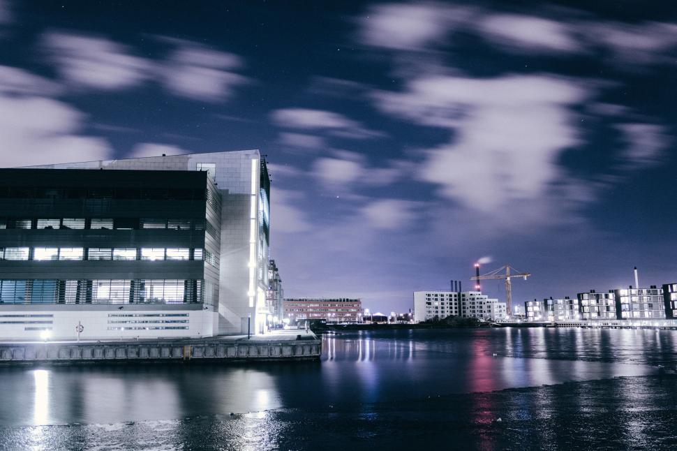 Free Image of Large Building Adjacent to Water Body 