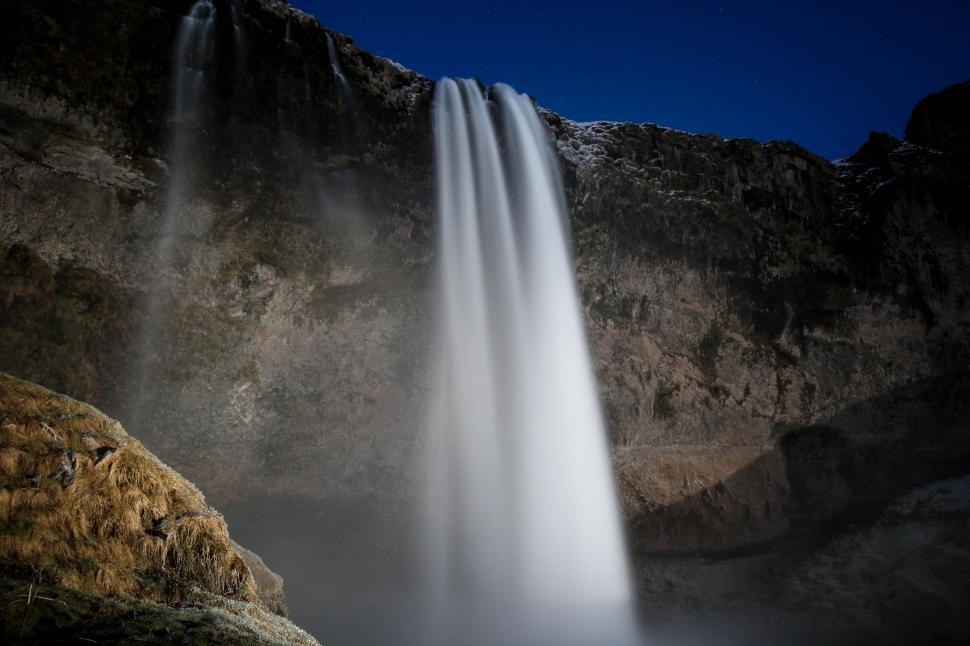 Free Image of Majestic Waterfall Amidst Mountain 