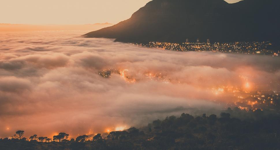Free Image of Majestic Mountain Blanketed in Fog 