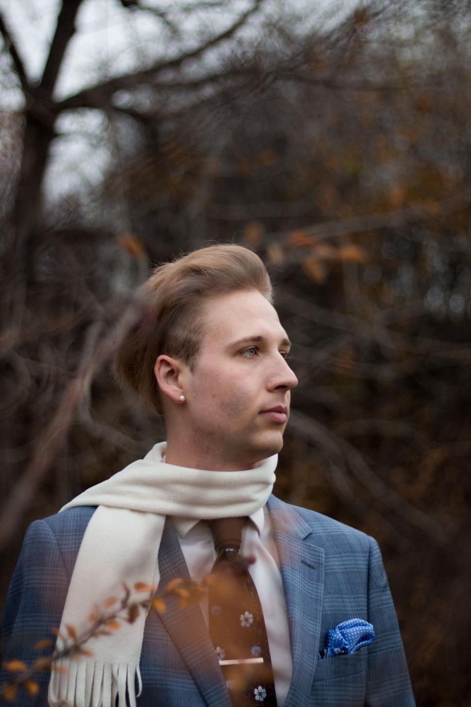 Free Image of Stylish Man in Blue Suit and White Scarf 