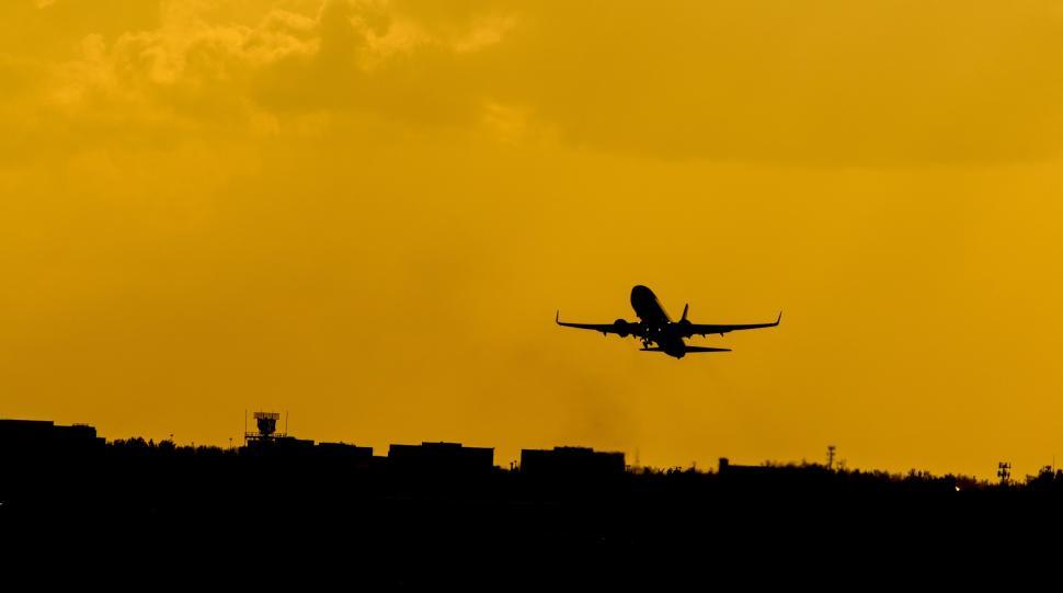 Free Image of Airplane Flying Over City 