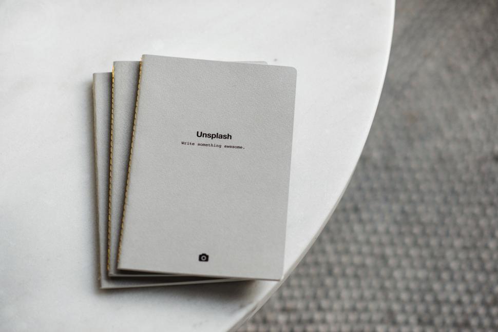 Free Image of Two Books on White Table 