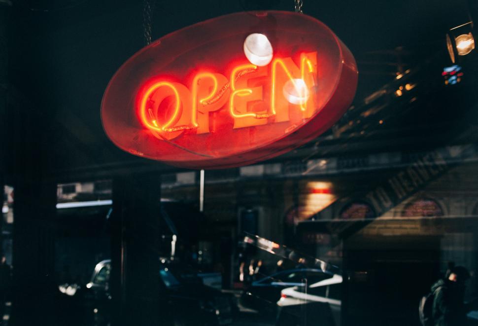 Free Image of Neon Sign Hanging From Restaurant Ceiling 