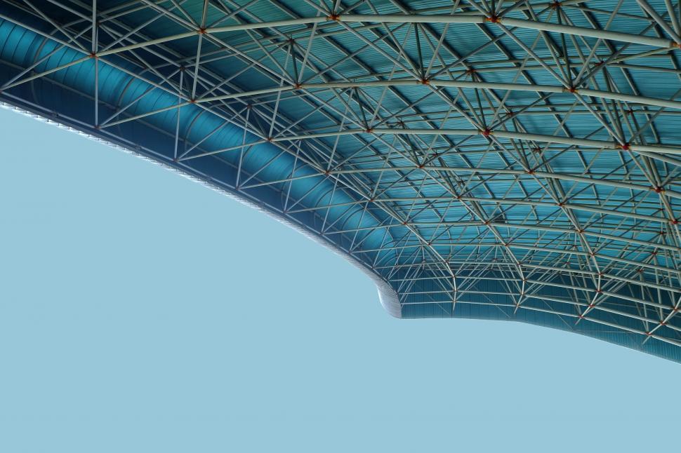 Free Image of Airplane Flying Under Roof 
