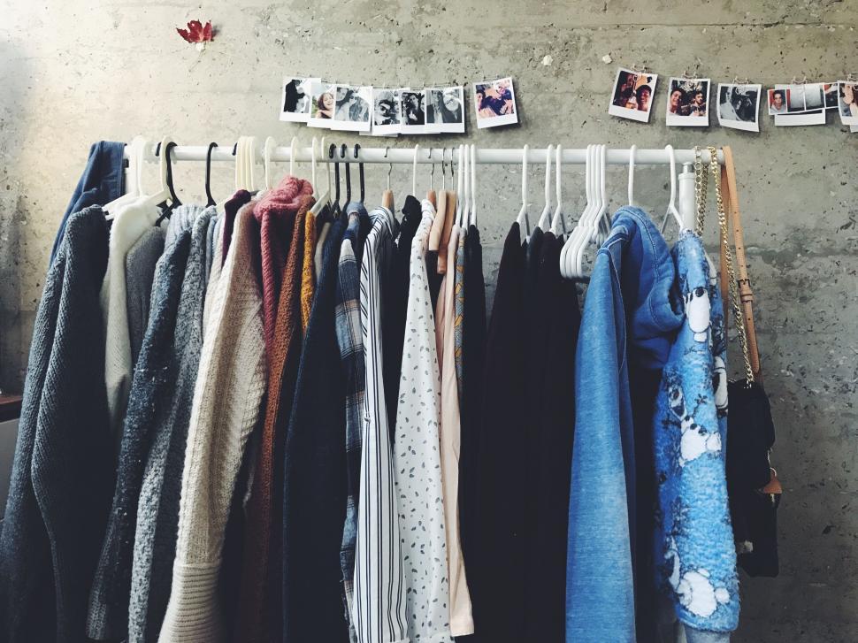 Free Image of Rack of Clothes Hanging on a Wall 