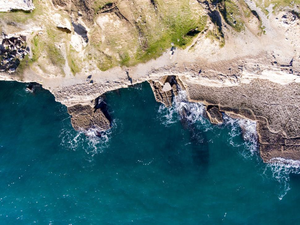 Free Image of A Birds Eye View of the Ocean and Cliffs 