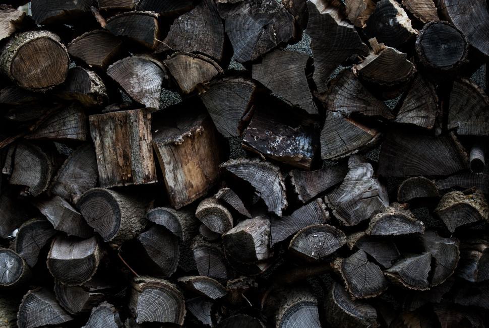 Free Image of Stack of Wood Logs Arranged Neatly 
