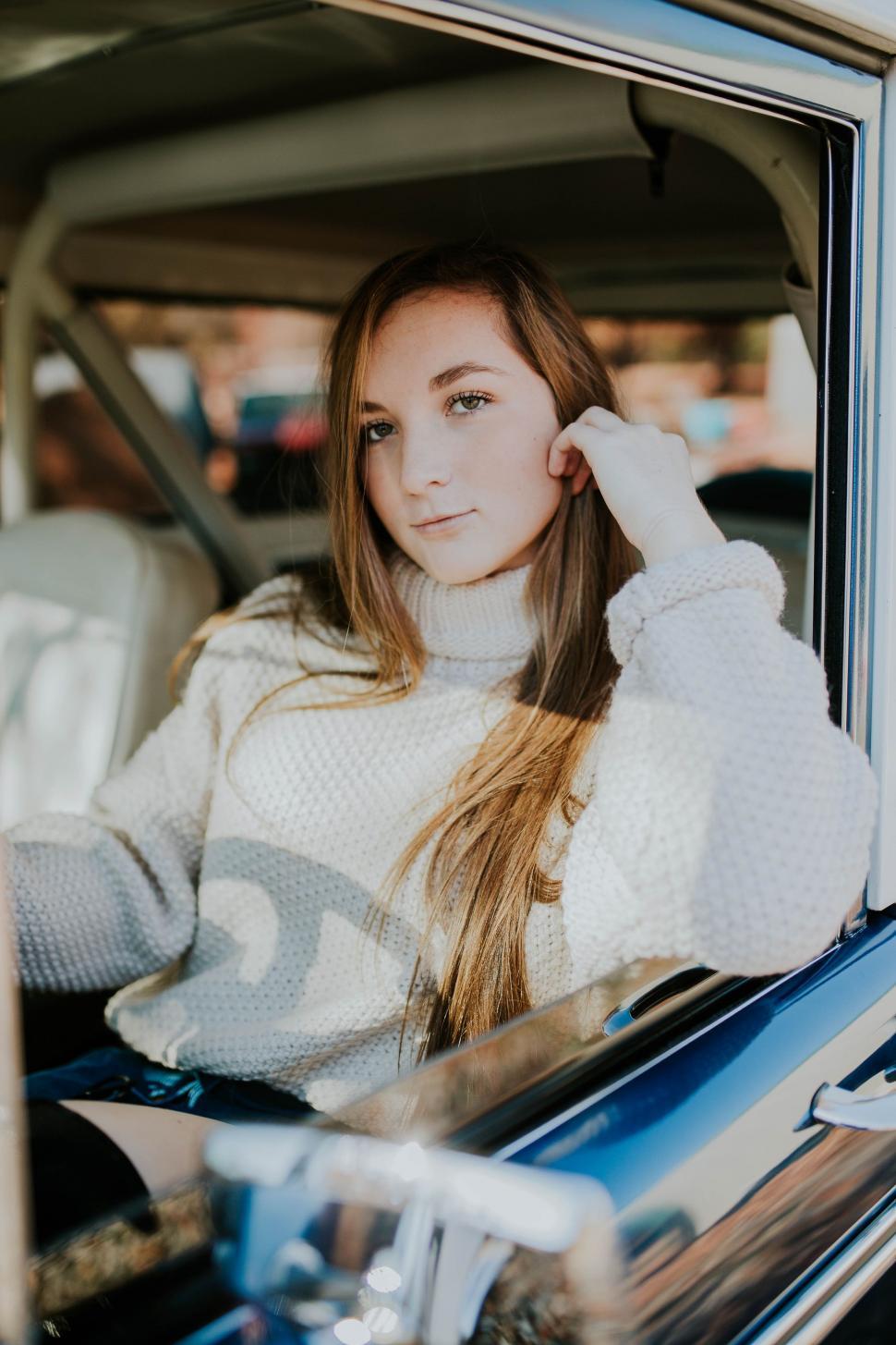 Free Image of Woman Sitting in Passenger Seat of Car 